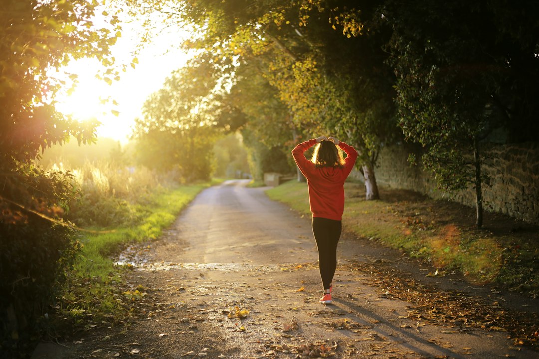 Runner on a countryside road during a sunny morning jog